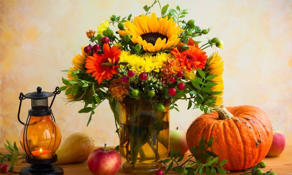 Display fall-themed foliage and flowers